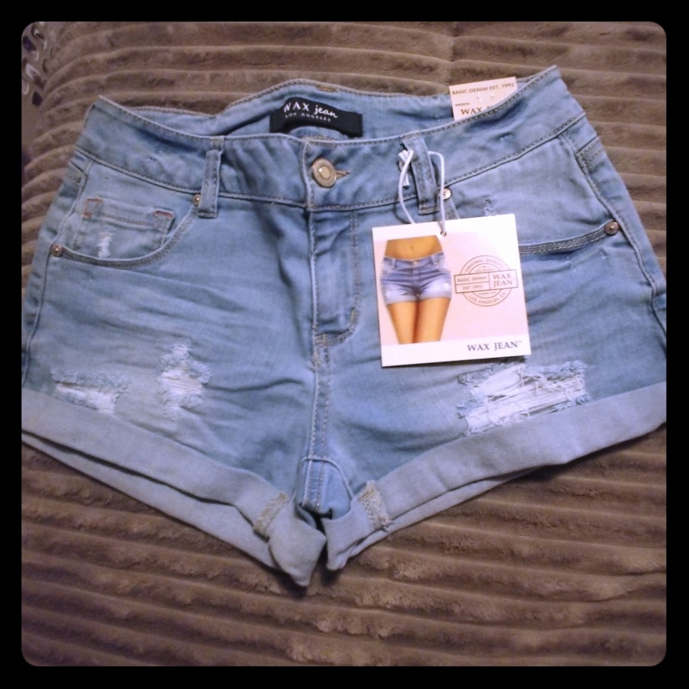 Light wash mid rise distressed denim shorts